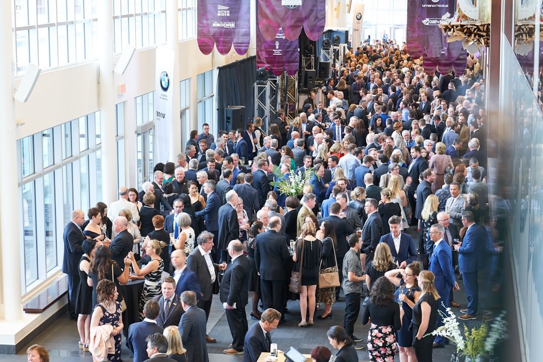 Modern business exhibition hall filled with professional attendees networking